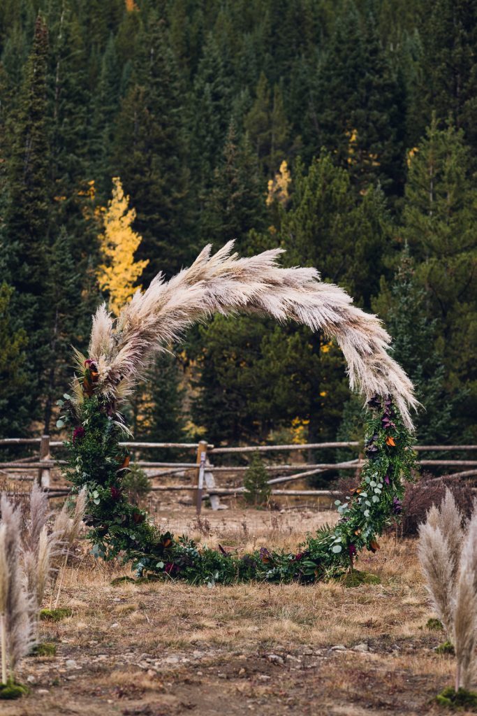 mountain-wedding-circle-arch-web-1 full circle wedding arch with greenery and pampas grass