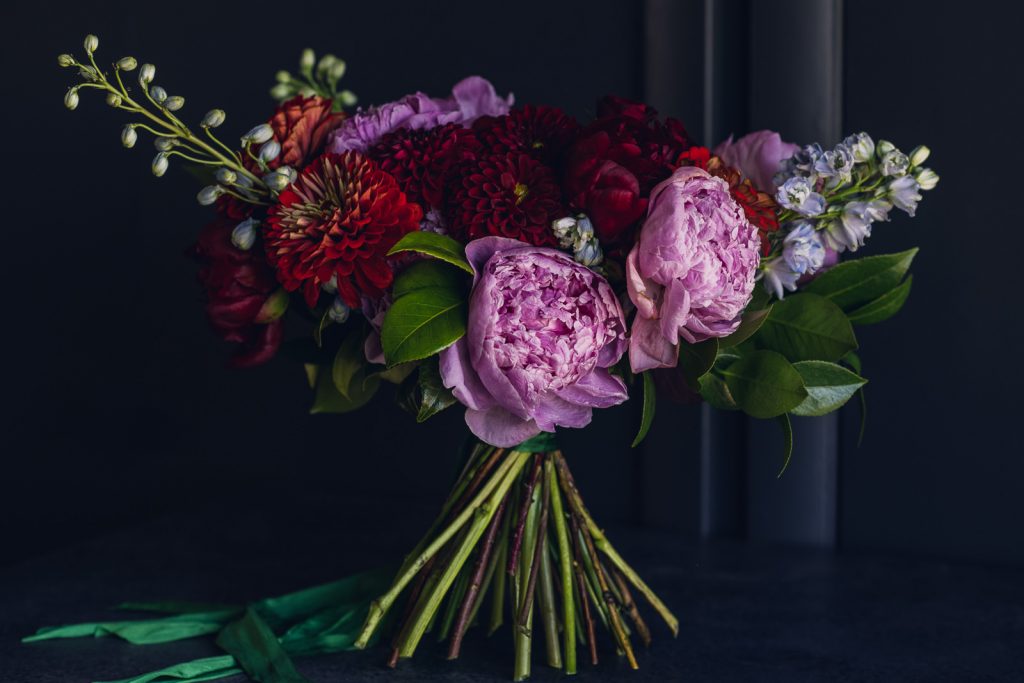 jewel tone bridal bouquet with pink peonies