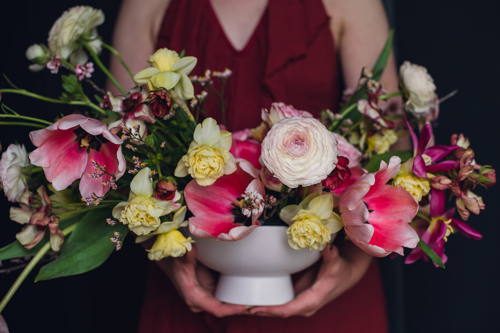pink-spring-bouquet-and-centerpiece-web-46 spring centerpiece of tulips daffodils and ranunculus