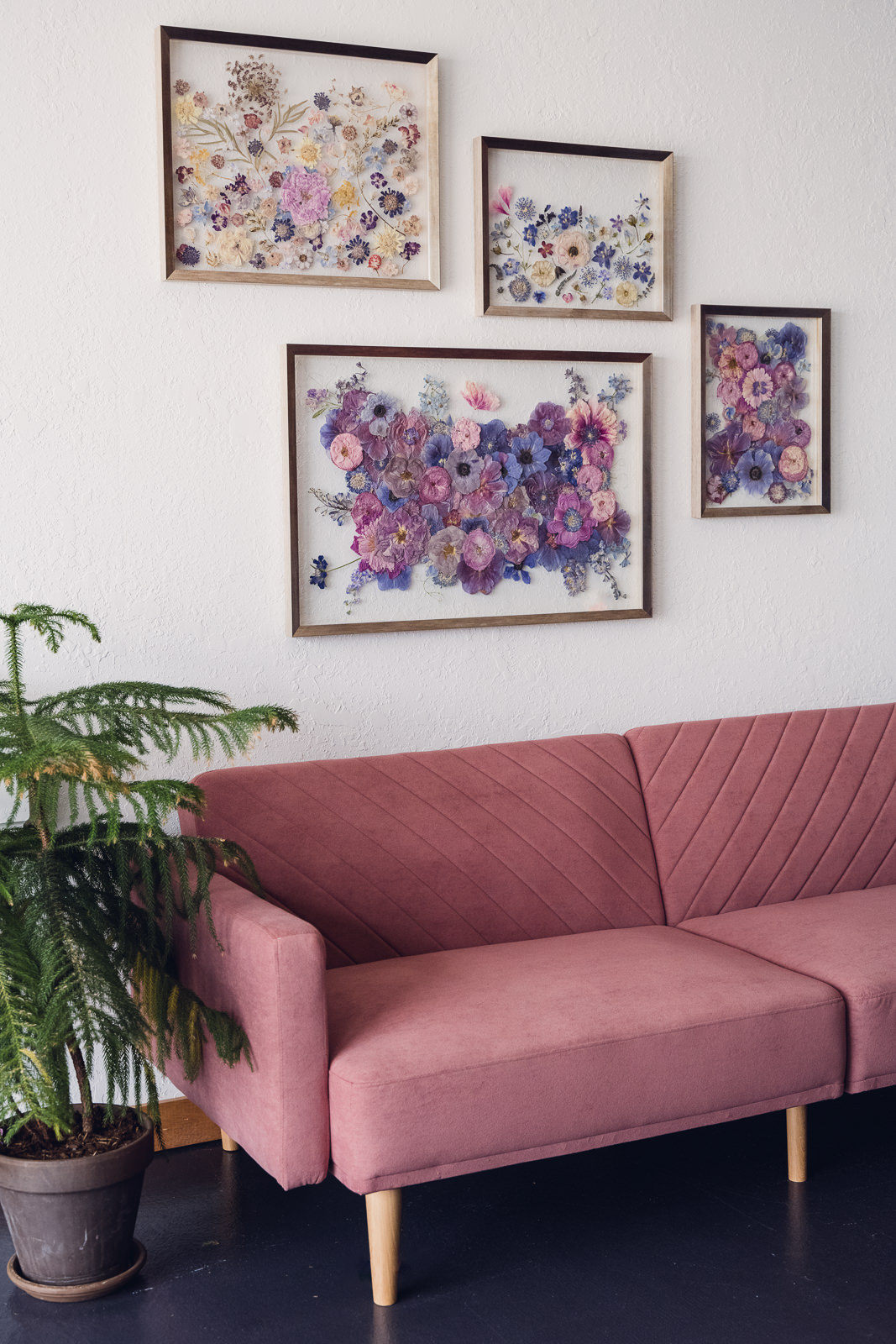 wild-blossoms-preservation-art-set-on-wall-web-12 pressed flower bouquet preservation art set hanging on the wall over a rose colored couch
