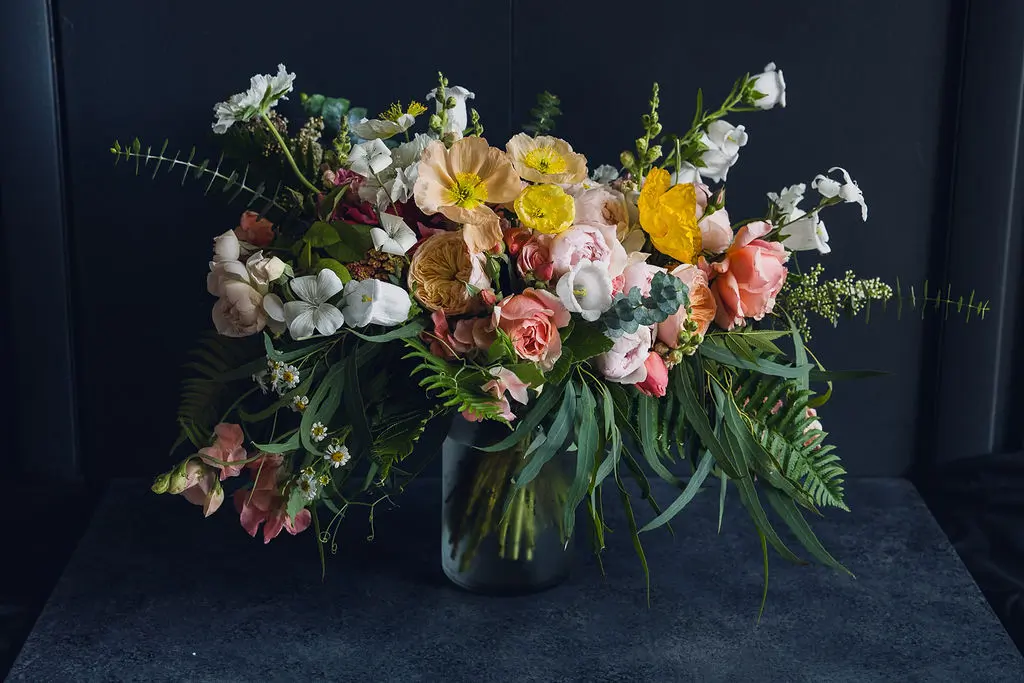 Bouquet ready for preservation. Bridal bouquet in a vase of fresh clean water.