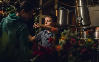 Floral designer Elycia Feldman creating a bridal bouquet with son in New York while photographer Melody Stevenson captures the process.