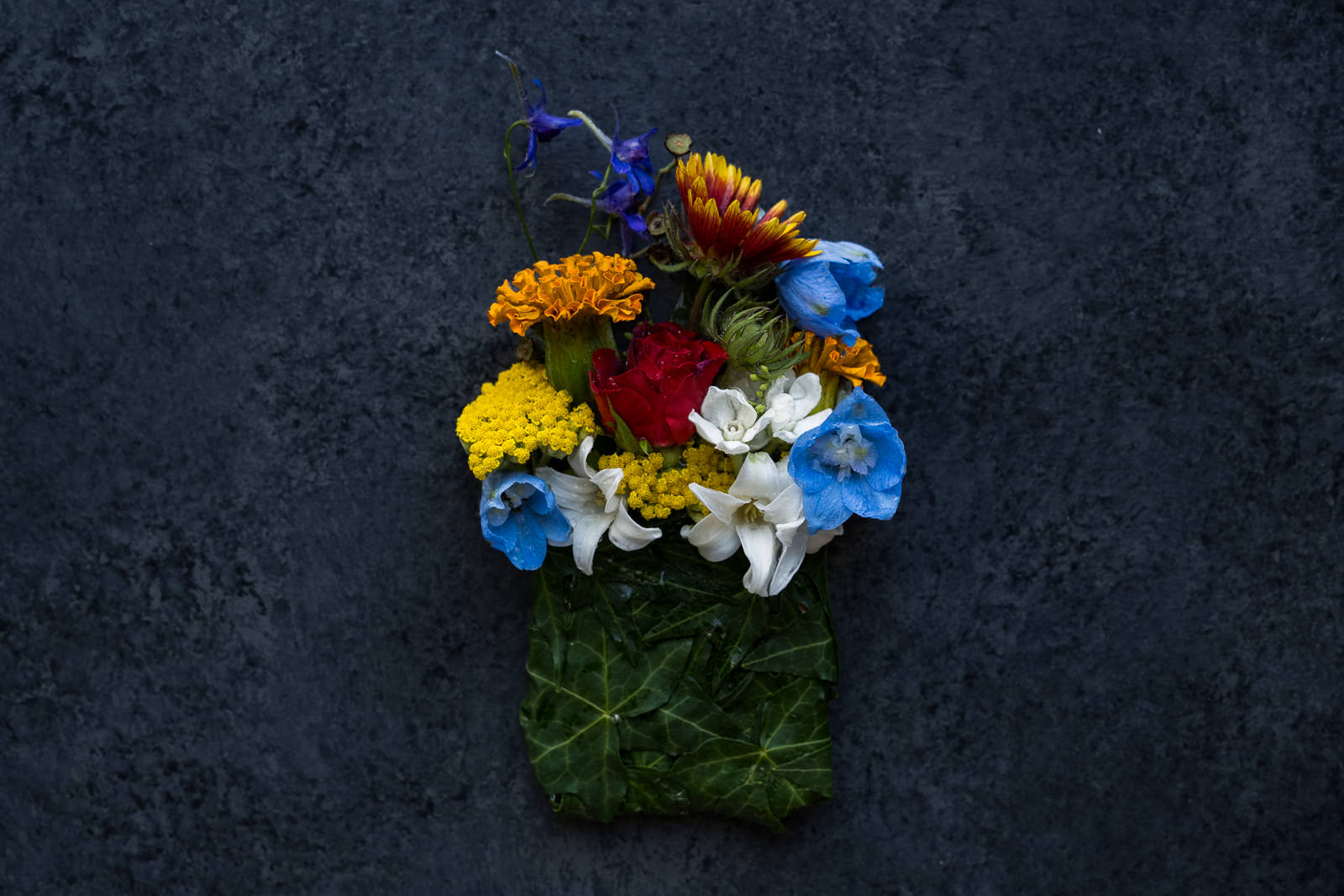 groom's floral pocket square of vibrant flowers for colorado wedding